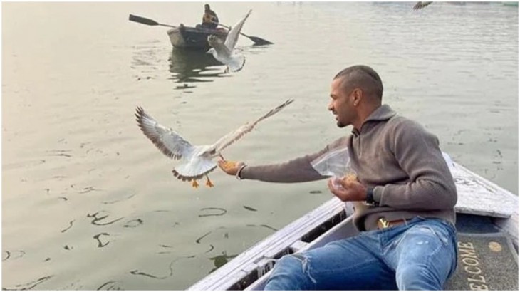 Shikhar Dhawan feeding birds during boat ride in Varanasi