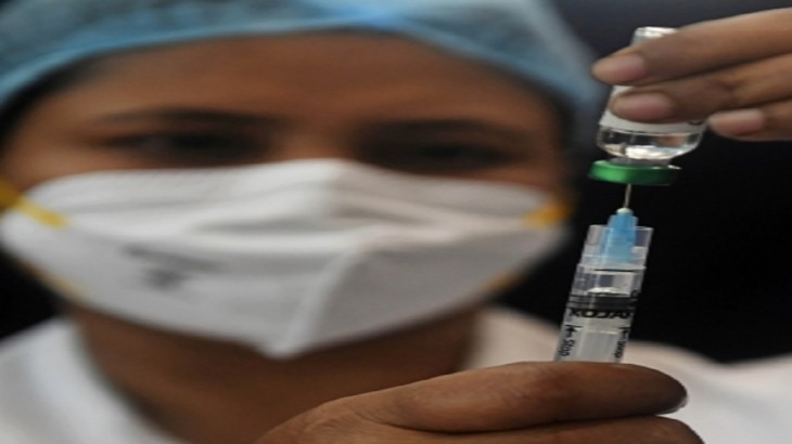 healthcare worker prepares to vaccinate